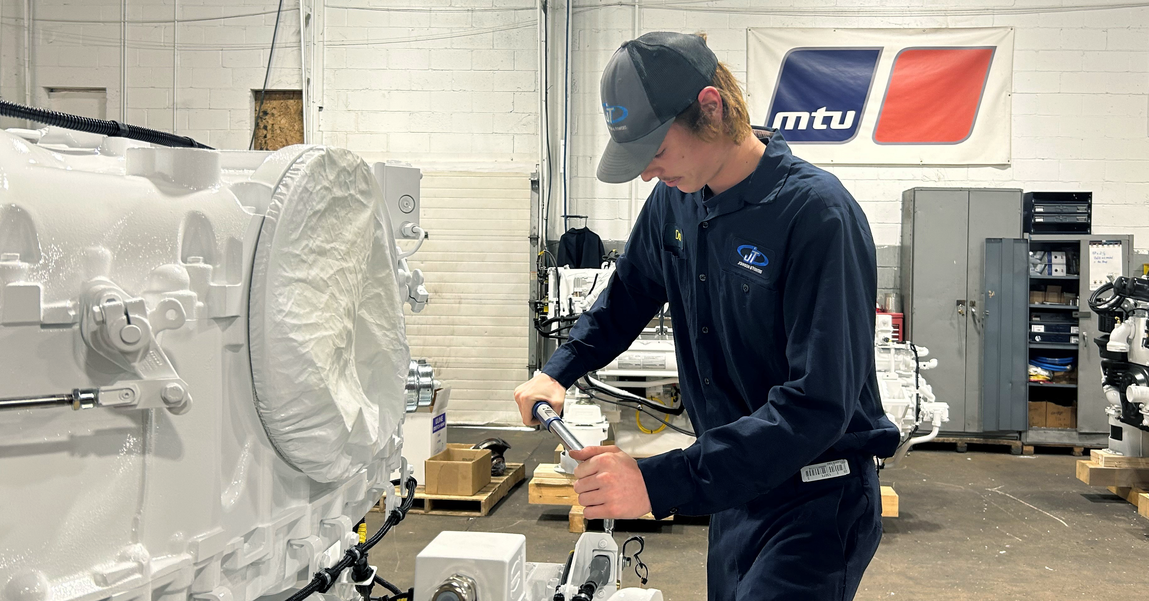 technician working on equipment in shop